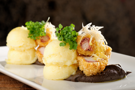 Fried octopus with potato and sauceの写真素材