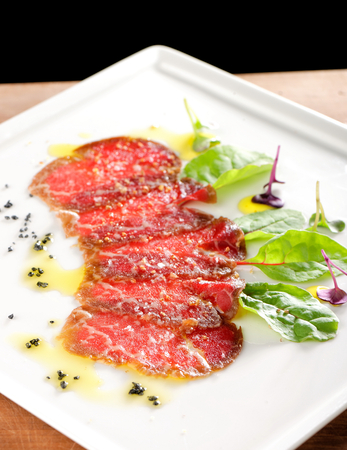 Fine dining, Kobe Beef carpaccio with black saltの写真素材