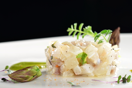 Fine dining appetizer, fish tartare with asparagusの写真素材