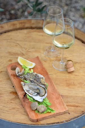 Open Oysters with sauce and champagneの写真素材
