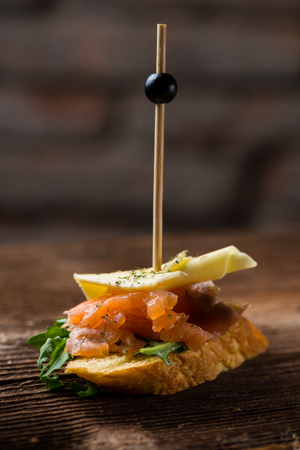 Tapas on Crusty Bread - Selection of Spanish tapas served on a sliced baguette.の写真素材