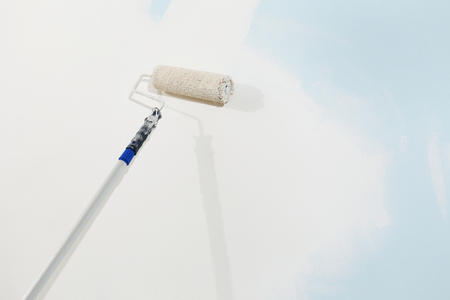 roller brush painter isolated on white wall, painting conceptの写真素材