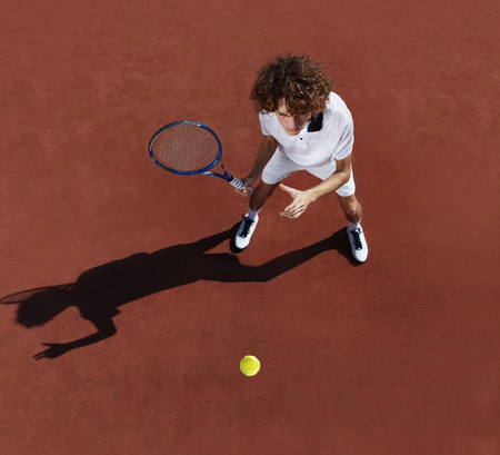 tennis player with racket during a match game in courtの写真素材