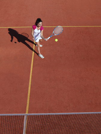 tennis player with racket during a match game in courtの写真素材