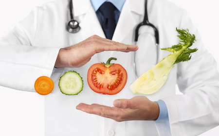 Healthy food and natural nutrition medical diet concept, hands doctor with vegetables.の写真素材