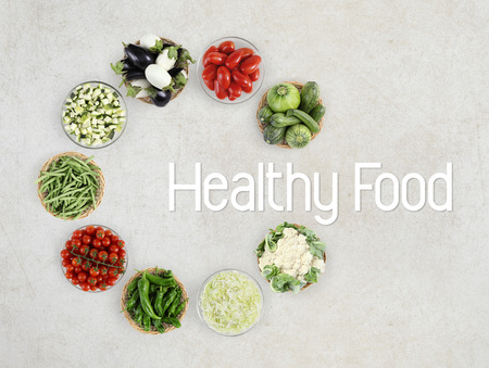healthy food text top view vegetables isolated on marble kitchen worktop, logo and copy space template.の写真素材