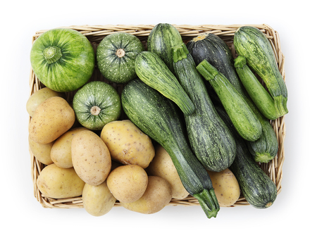 Basket of zucchini, and potatoes food top view isolated on white background.の写真素材
