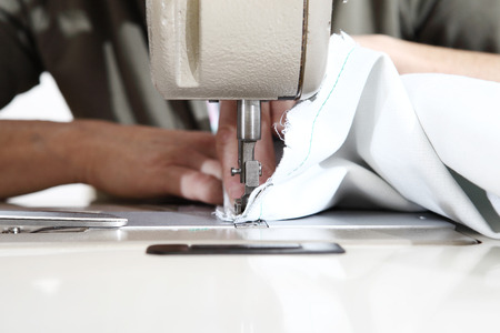 woman hands sewing machine, close up.の写真素材
