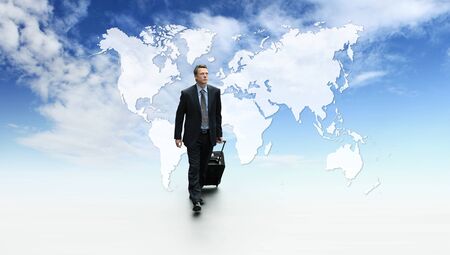 international business travel, success concept walking with trolley and briefcase, on blue sky with map background.の写真素材