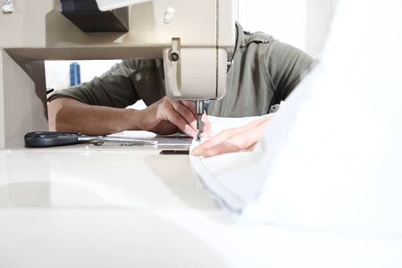 woman hands sewing machine, close up.の写真素材