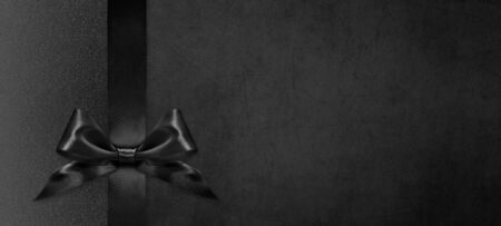 black gift card with black ribbon bow, black friday concept, copy space template.の写真素材
