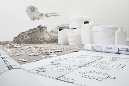 house renovation and plan concept. Blue print project draw. Buckets and jerry can products for...