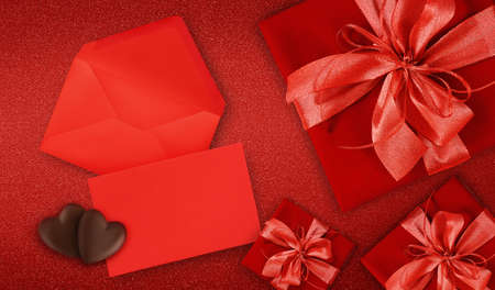 valentines day gift card, red boxes with red shiny ribbon bow, isolated on red background, blank...