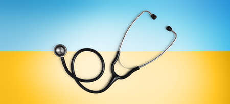 Ukraine medical protection aid concept, doctor stethoscope isolated on yellow and blue colors of the flag of Ukraine. Relief for the injured and refugees. Banner with copy spaceの写真素材