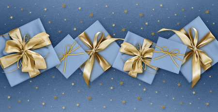 merry christmas, gift box with golden ribbon bow isolated on blue sparkle background with stars,...