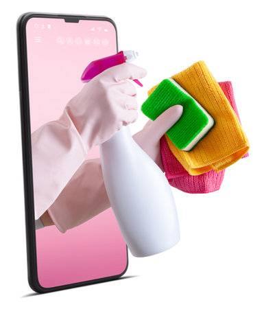 Cleaning service and products. Hands with gloves, rags and spray bottle from the smart phone...