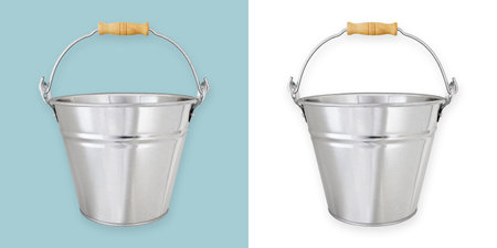 Metal garden vintage bucket with wooden handle, tool equipment for gardening or decorating flower arrangements for potting plants, front view isolated on white and light blue backgroundの写真素材