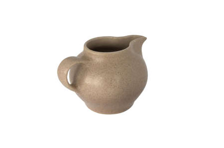 Brown small ceramic cream-jug of the coffee set isolated over whiteの写真素材