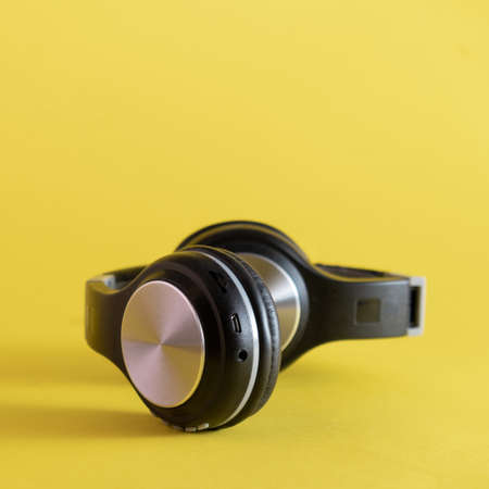 Music headphones on a yellow background