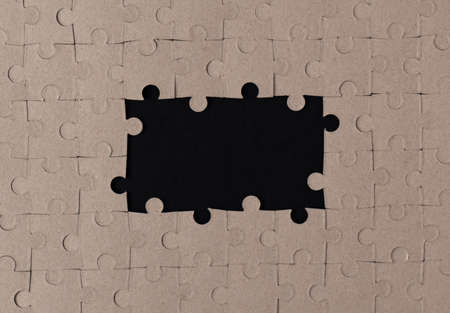 Paper puzzles on a black background.Flat lay. Copy space