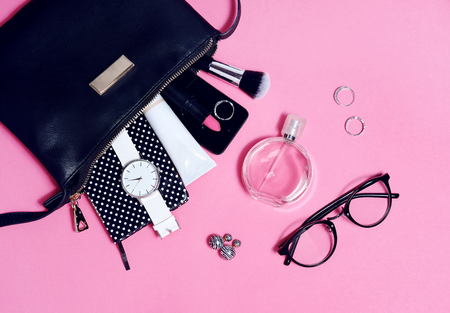 Overhead view of set female essential beauty items on pink flat layの写真素材