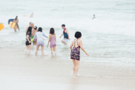 Tourists are swimming on the sea in Bali, Indonesia.の写真素材