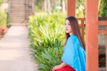 Asian woman wearing traditional Thai culture,Asian woman wearing typical Thai dress identity culture of Thailand.の写真素材