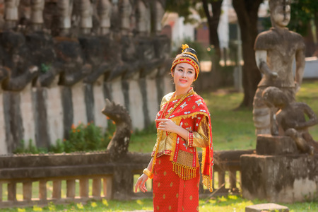 Beautiful girl in Laos costume,Asian woman wearing traditional Laos culture at temple.Vintage style.の写真素材