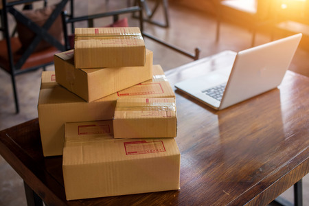 Packing accessories at workplace of startup small business owner, cardboard parcel box for online selling. entrepreneur,cardboard parcel box for online selling.shipping concept.の写真素材