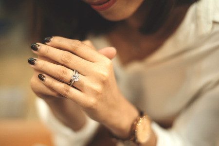 An engagement ring,An engagement ring is a ring indicating that the person wearing it is engaged to...