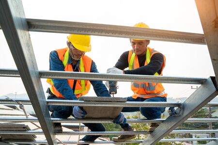 Engineers worker install new CPAC roof,Roofing tools,Electric drill used on new roofs with CPAC...