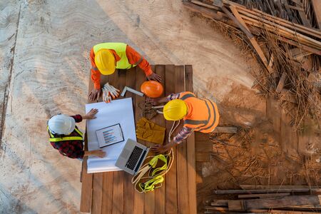 Aerial view of group of Asian engineers or architect and construction worker at construction site.の写真素材
