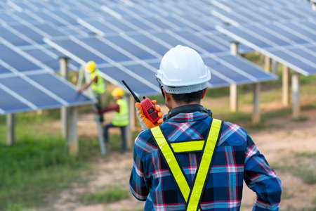 Electrician checking solar panels,Green energy,Solar power plant to innovation of green energy for life.の写真素材