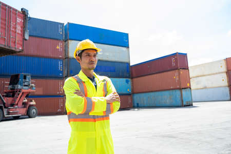 Container worker checking container box for logistic export and import in dock.の写真素材