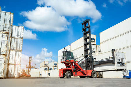 The working of crane lifting up container in logistic shipping yard.の写真素材