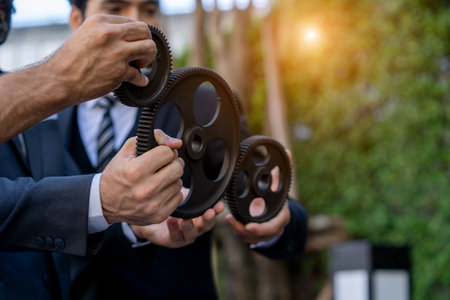 Group Of Businesspeople Joining Together Gears,Business cooperation concept business team innovation strategy integration teamwork contract integration.の写真素材