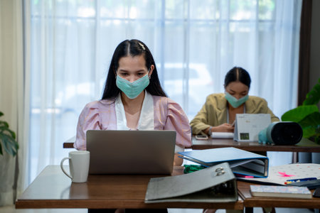 Asian business people wear protective face mask .の写真素材