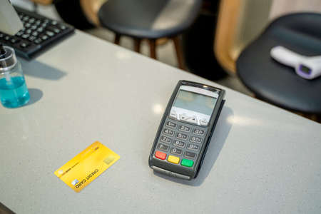 Credit card and card reader,Payment terminal top view composition.の写真素材