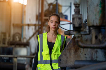 Portrait of industrial woman engineer working in a factory.の写真素材
