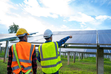 Professional worker working and installing solar panels,Innovative solution for energy solving,Use...