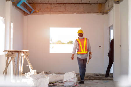 Engineer working with foreman about project in building construction site,Construction project concept.の写真素材