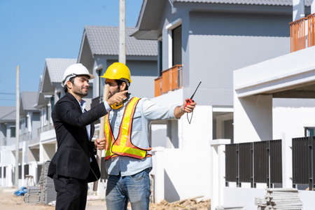 Architect concept,Architects and businessman working with blueprints at construction...