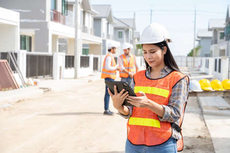 Engineers and architect discussion for plans for new home and working on a building site,Architecture concept.の写真素材