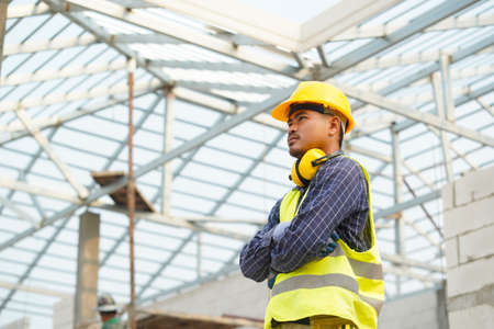 Portrait of construction engineer worker,Civil engineer checking work at the construction site.