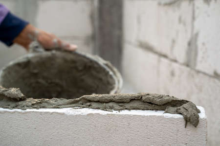 Close up of industrial cement installing cement on construction site.の写真素材