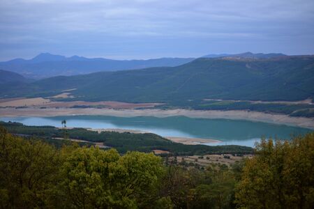 Wonderful views of the lake that forms in the surroundings of the river Aragon in the dam of Yesa.の写真素材