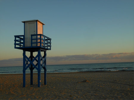 Watchtower at sunset near the central beach of Isla Cristina, Huelva, Costa de la Luz, Spainの写真素材