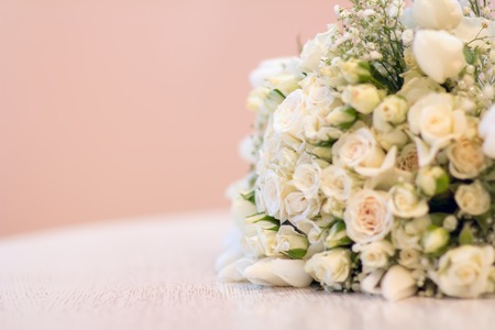 The bride's bouquet, white roses, tulips, delicate flowers, use as background or texture, soft pastel colors.の写真素材