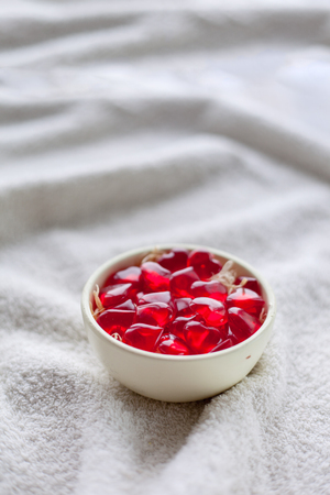 Gummy candy in a vase on white cloth.の写真素材