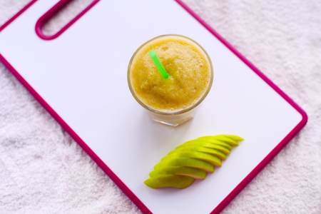 smoothie of apples, pears, oranges, bananas, stand on the white Board, healthy drinkの写真素材